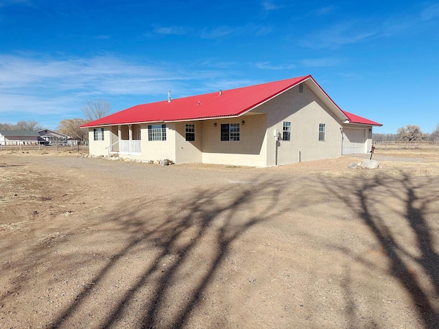 back of house with a garage