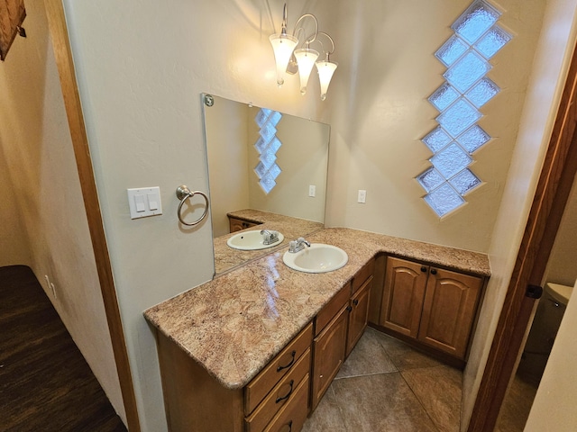 bathroom with tile patterned floors and vanity