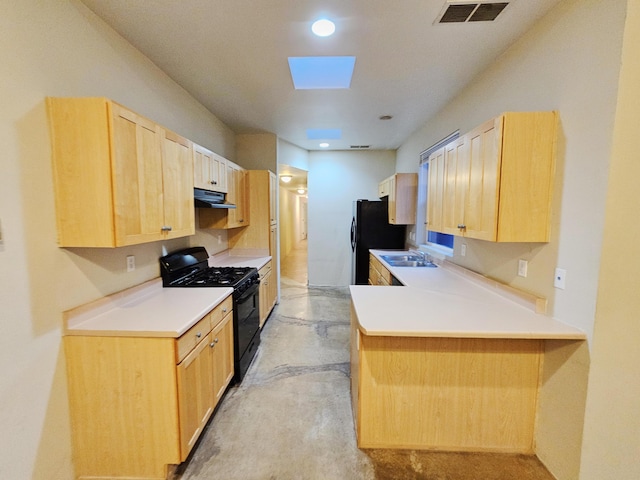 kitchen featuring sink, black appliances, light brown cabinets, kitchen peninsula, and exhaust hood