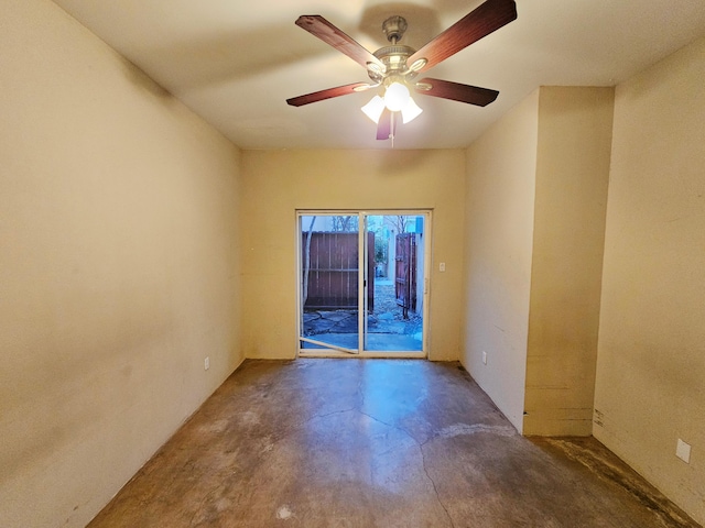 spare room featuring concrete flooring and ceiling fan