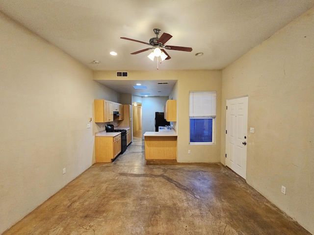 kitchen with ceiling fan and black appliances