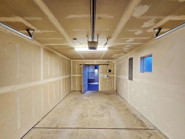 garage featuring a garage door opener and electric panel