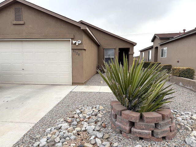 ranch-style home with a garage