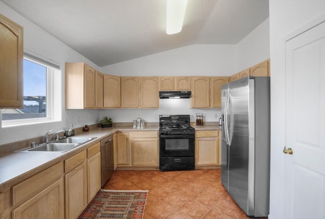 kitchen featuring vaulted ceiling, appliances with stainless steel finishes, light tile patterned flooring, light brown cabinetry, and sink