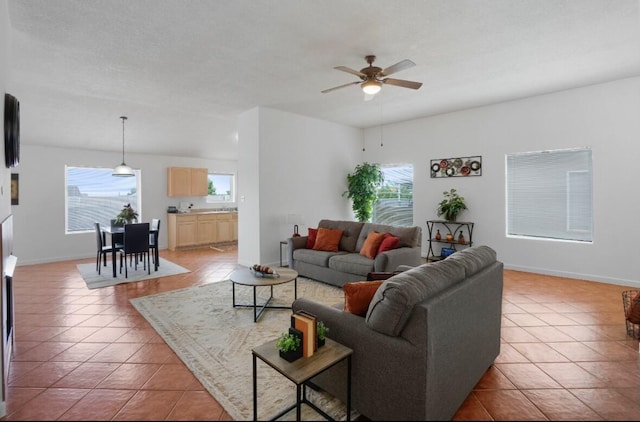 living room with light tile patterned flooring and ceiling fan