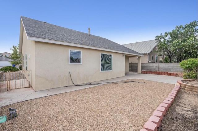 back of house with a patio area