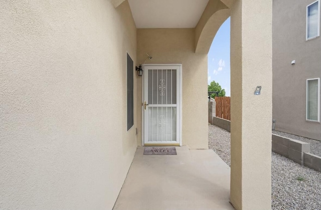 property entrance featuring a patio