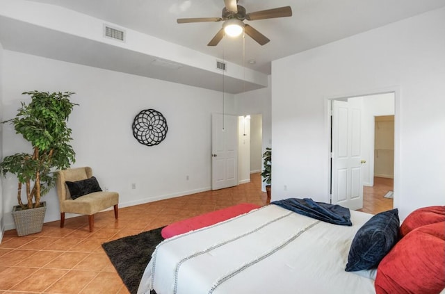 tiled bedroom featuring ceiling fan