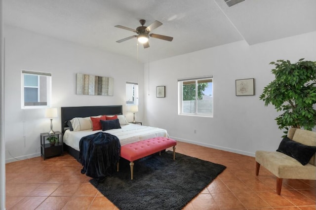 bedroom featuring ceiling fan and tile patterned flooring