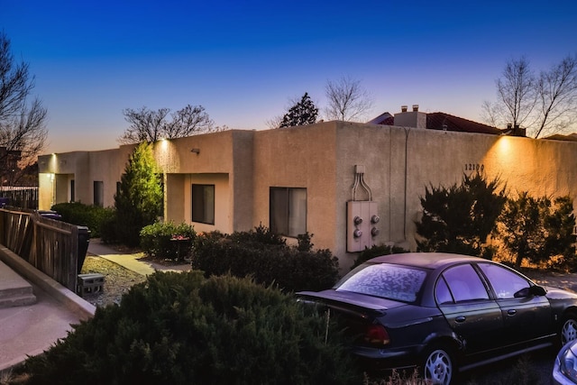 view of property exterior at dusk