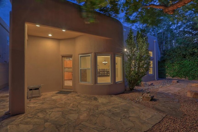 exterior space featuring a patio area and a wall mounted AC