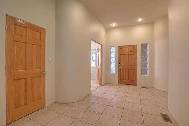 entrance foyer with light tile patterned floors