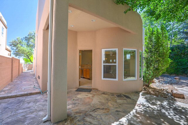 doorway to property with a patio