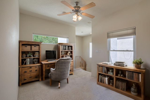 home office featuring light colored carpet and ceiling fan