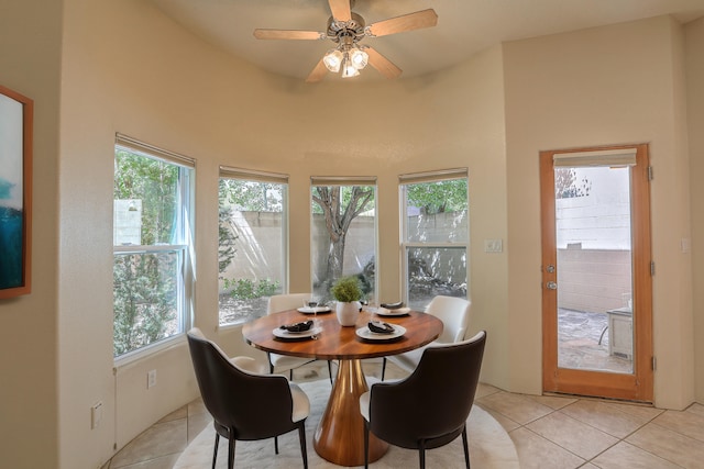 dining space featuring a healthy amount of sunlight, light tile patterned floors, and ceiling fan