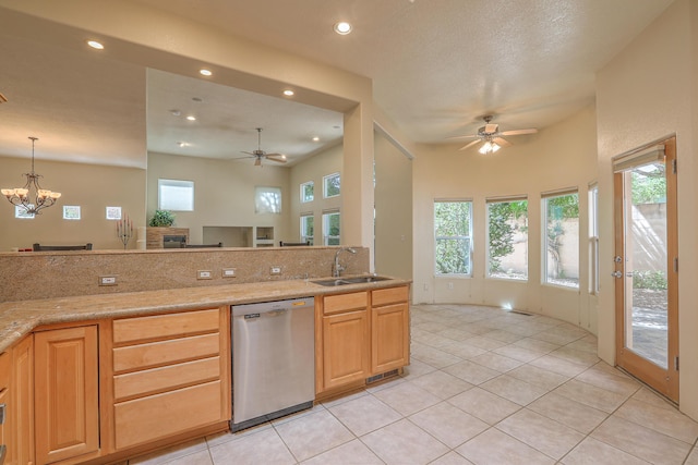 kitchen featuring tasteful backsplash, sink, a wealth of natural light, and dishwasher