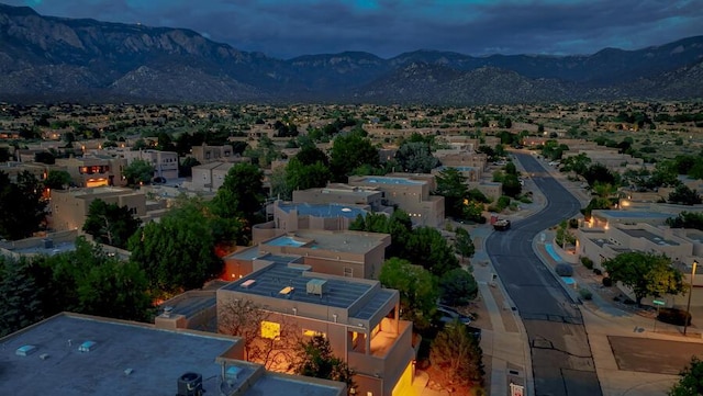 birds eye view of property featuring a mountain view