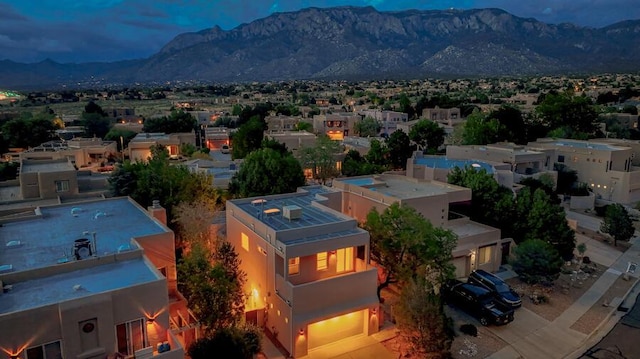 birds eye view of property with a mountain view