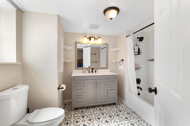 full bathroom featuring toilet, shower / tub combo, a textured ceiling, vanity, and tile patterned flooring