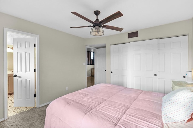 bedroom featuring ensuite bathroom, ceiling fan, and carpet flooring