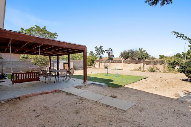 view of yard with a patio area and a storage shed