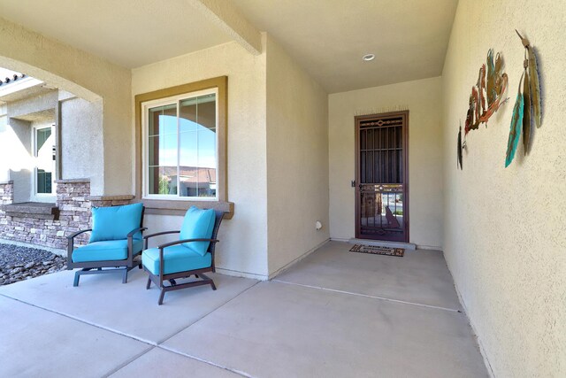 entrance to property featuring a patio