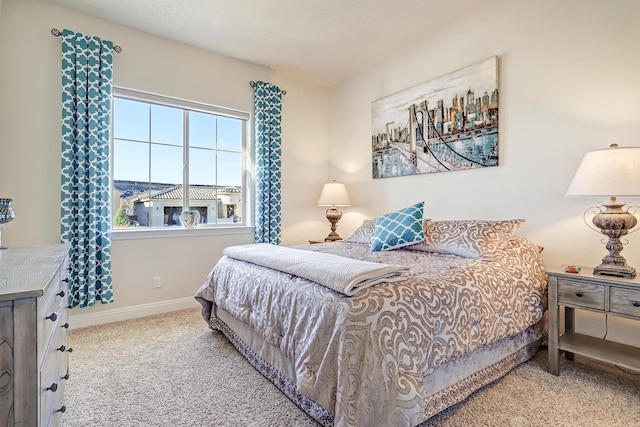 bedroom with light colored carpet