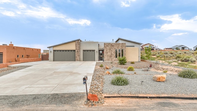 pueblo-style house with a garage