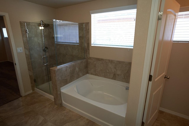 bathroom with tile patterned floors and plus walk in shower