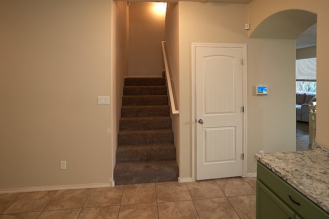 stairs with tile patterned flooring