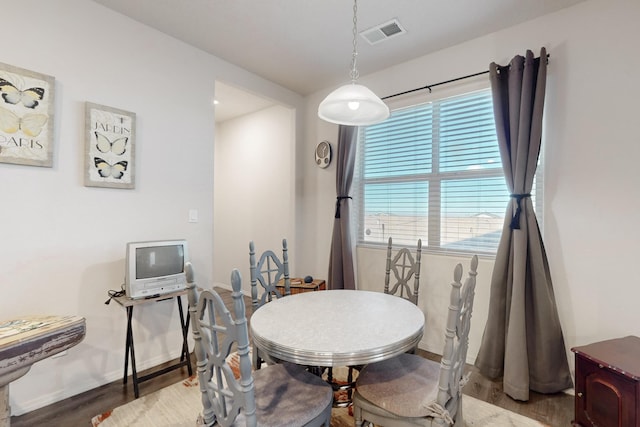 dining area with hardwood / wood-style flooring