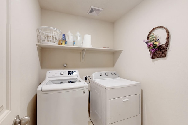 laundry room featuring washing machine and dryer