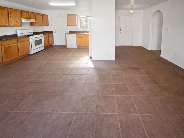 kitchen featuring sink and white appliances