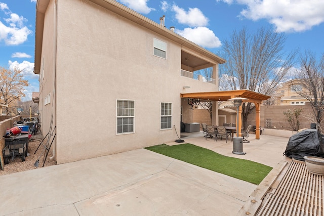 back of property with a patio area