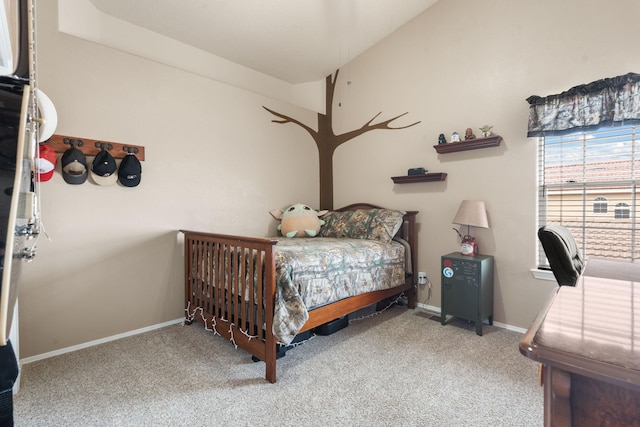 carpeted bedroom featuring vaulted ceiling