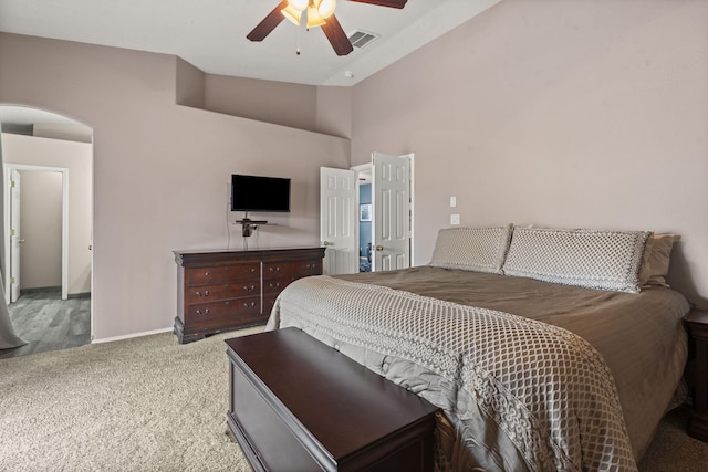 bedroom featuring vaulted ceiling, ceiling fan, and carpet