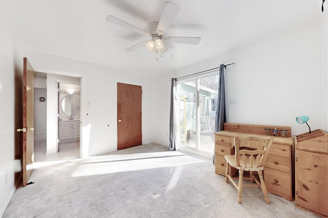 office space with ceiling fan and light colored carpet