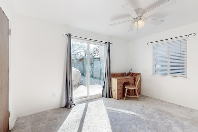 carpeted empty room with ceiling fan