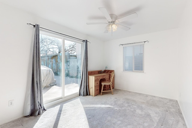 carpeted bedroom with access to outside and ceiling fan