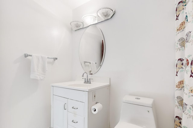 bathroom with vanity and toilet