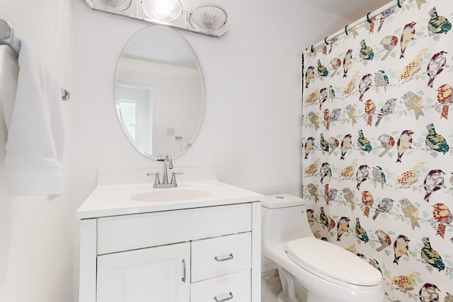 bathroom with vanity and toilet