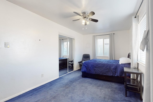 carpeted bedroom featuring multiple windows, a closet, and ceiling fan