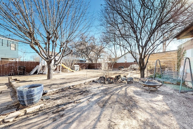 view of yard with a patio and a fire pit