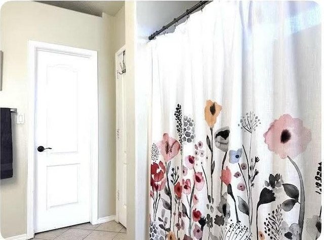 bathroom with tile patterned floors