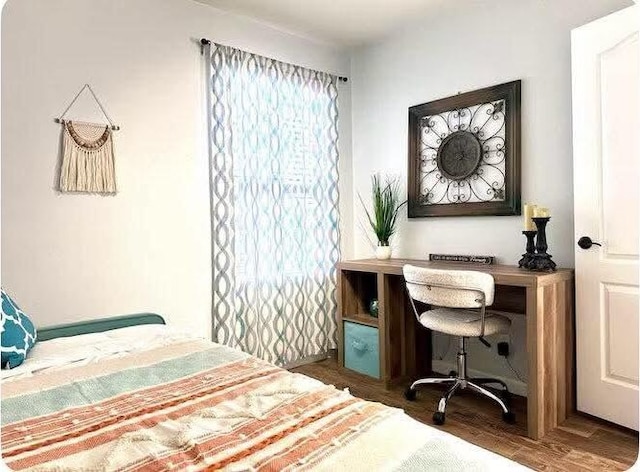 bedroom featuring dark hardwood / wood-style floors