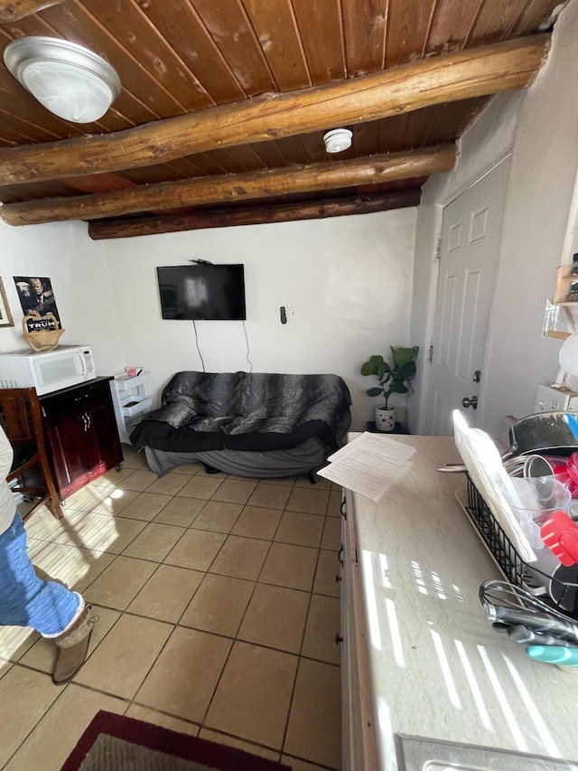 tiled living room with beamed ceiling and wooden ceiling