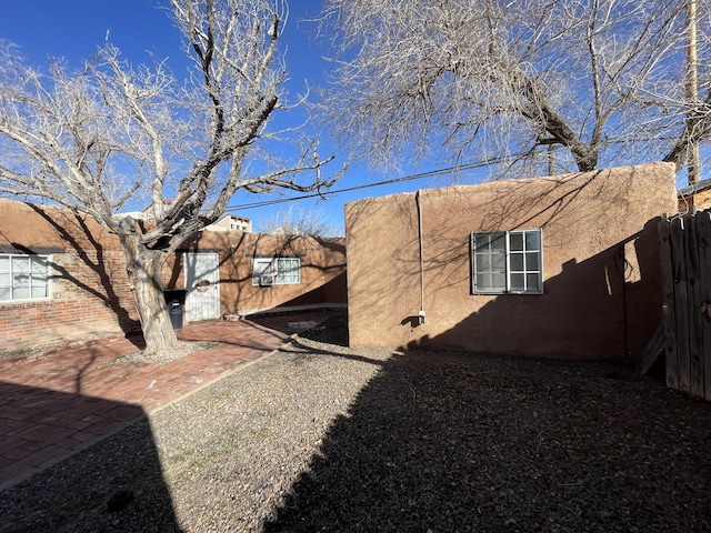 view of side of property featuring a patio area