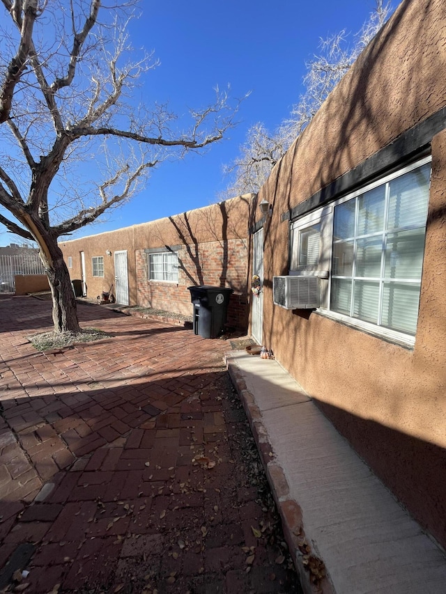 view of yard with cooling unit and a patio