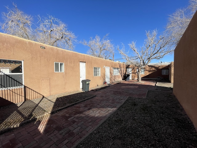 view of side of home featuring a patio area