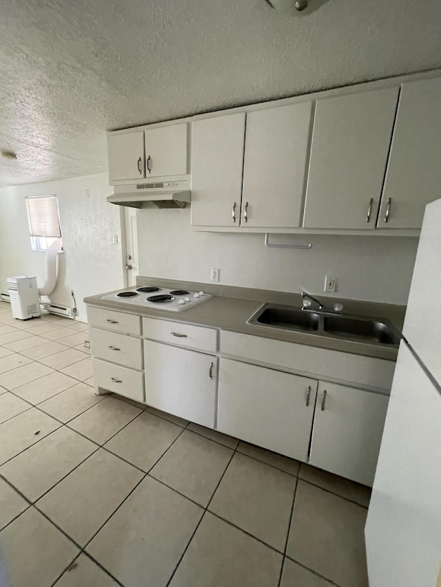 kitchen with sink, white cabinetry, white stovetop, a textured ceiling, and light tile patterned flooring